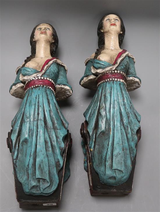 A pair of model ships figureheads length 49cm